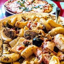 Carmella's Cafe signature dishes Chicken RiggiesHaddock FrancaiseGreens MorelleVeal Parmigiana